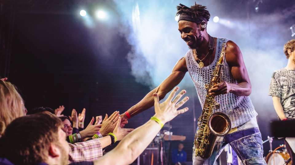 Shabaka Hutchings on sax, reaches into the crowd, after his Comet is Coming show for the UK-Russia Year of Music